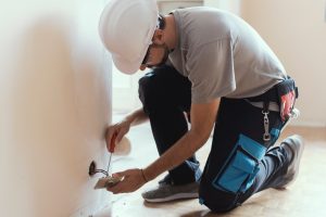 Electrician installing an outlet in Ocala, Florida